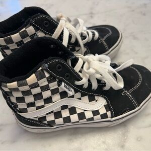 Vans white and black kids shoe.